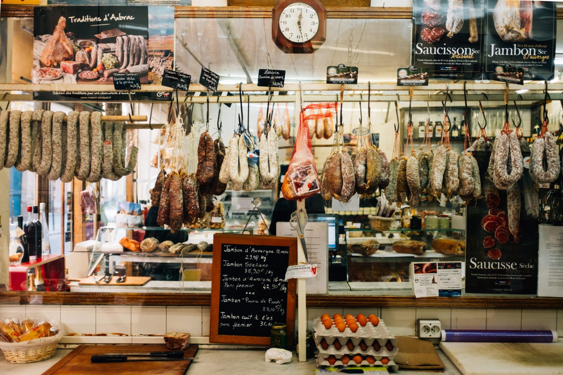 deli-with-cured-meat-on-hooks-and-eggs-on-counter (1)